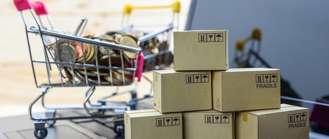 shopping cart with boxes on a laptop shopping cart with boxes on a laptop